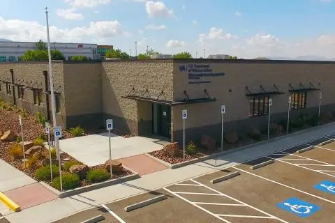 Exterior of the El Paso Westside VA Clinic building with U.S. Department of Veterans Affairs signage and accessible parking